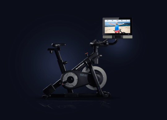 Profile shot of bike on blue background. Screen is facing is tilted to view.