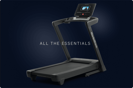 Profile shot of a treadmill on dark blue gradient background