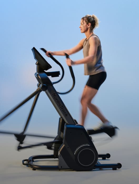 woman exercising on a nordictrack elliptical