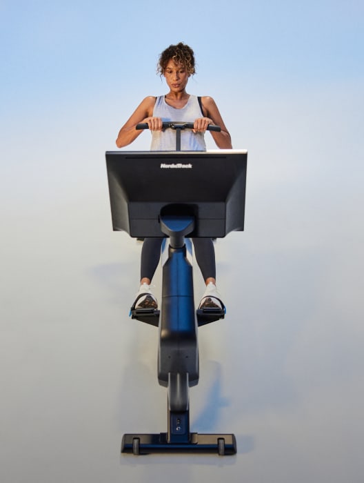 woman exercising on a nordictrack rower