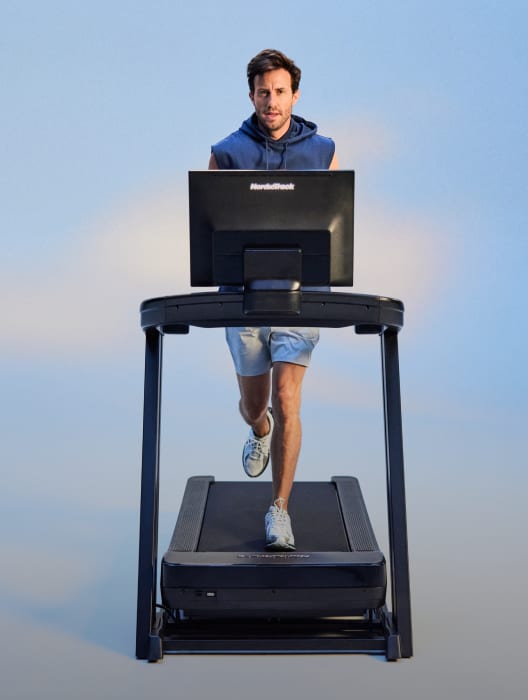 man running on a nordictrack treadmills