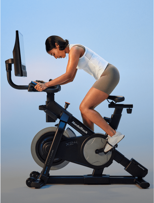 woman exercising on a nordictrack exercise bike