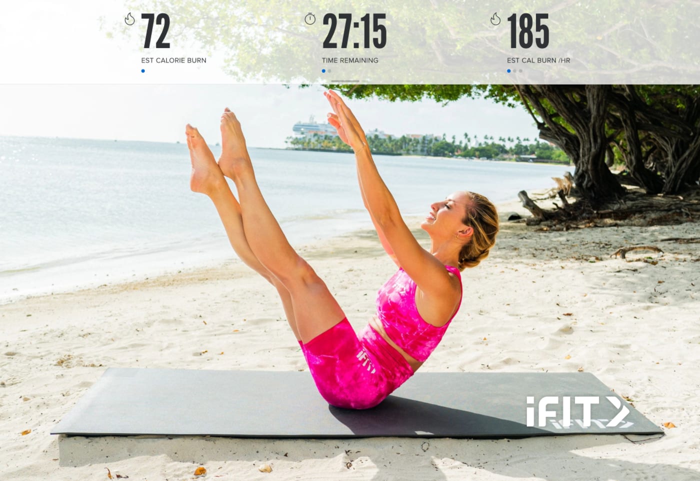 Woman doing Pilates Exercises on the. beach on a mat