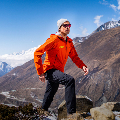 Trainer hiking high in the mountains.