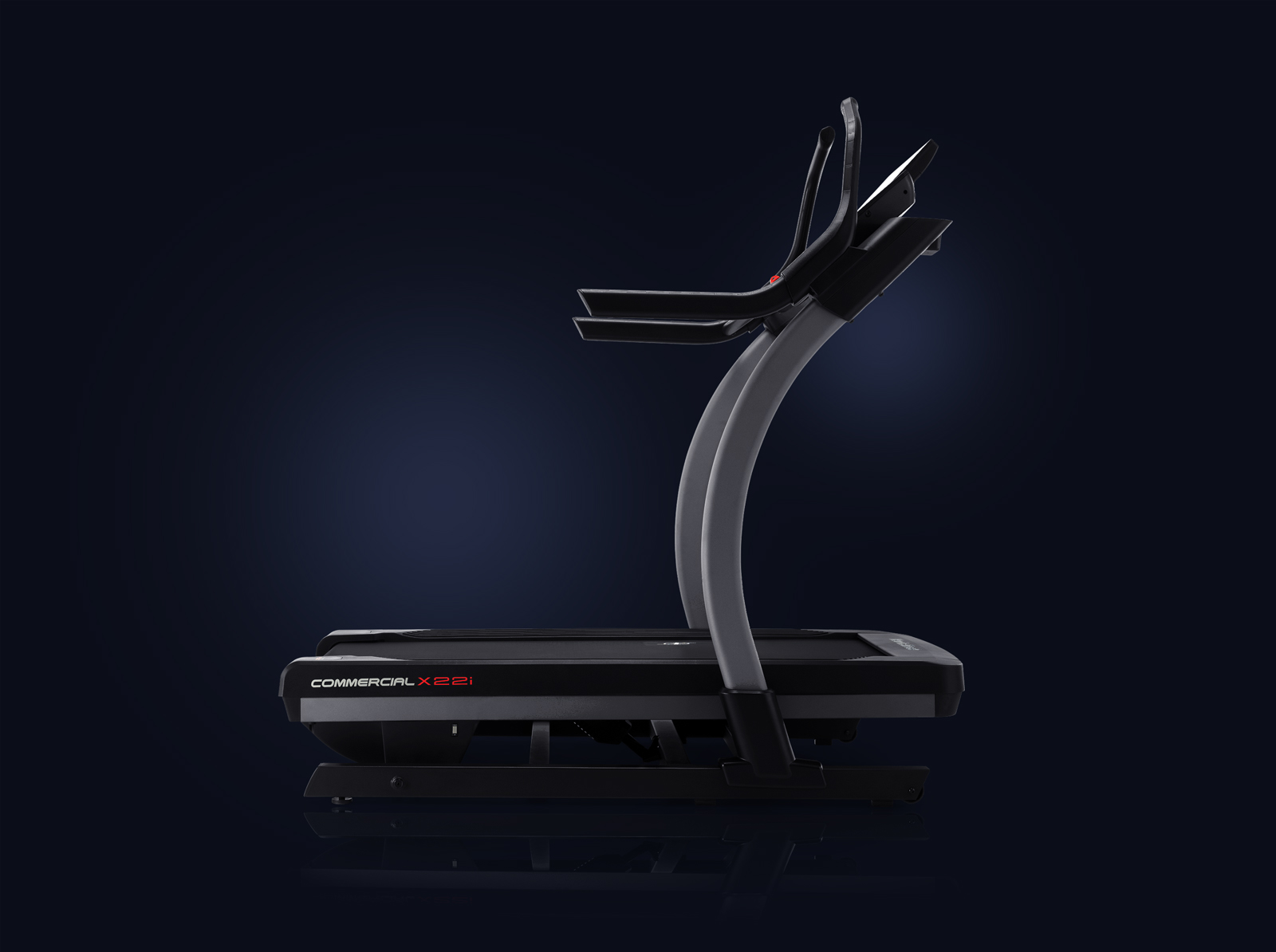 Profile view of the x22i treadmill on a dark blue gradient background