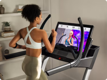 woman running on a nordictrack treadmill in her house
