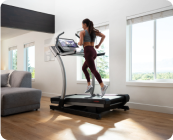 woman running on a nordictrack incline treadmill