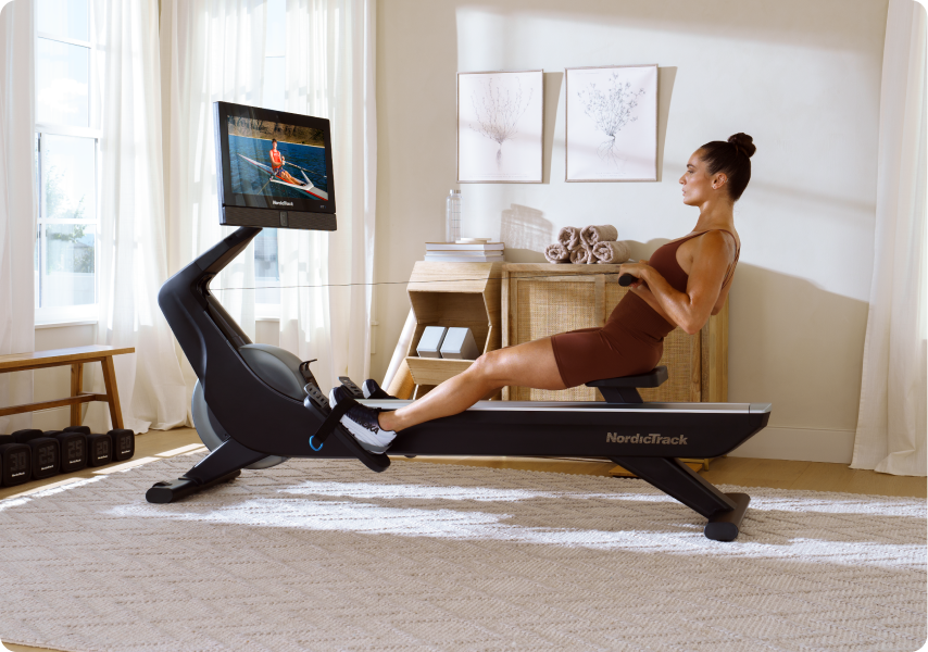 Woman rowing on the RW900 Rower.