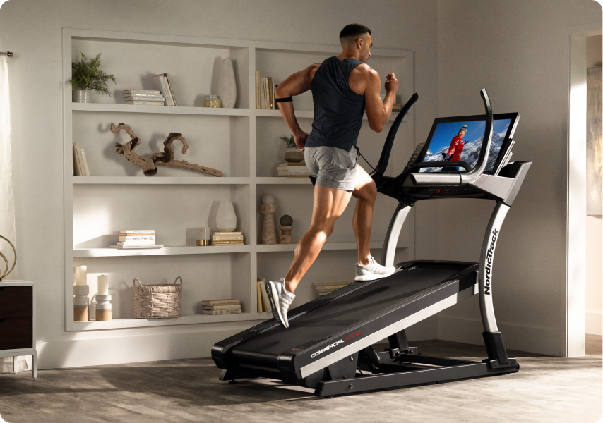 Man running on a treadmill with an incline.