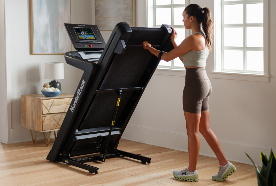 woman folding her nordictrack treadmill