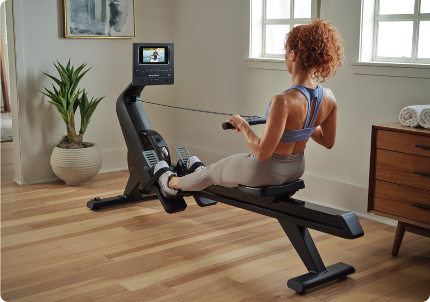 Woman rowing on the RW600 Rower.