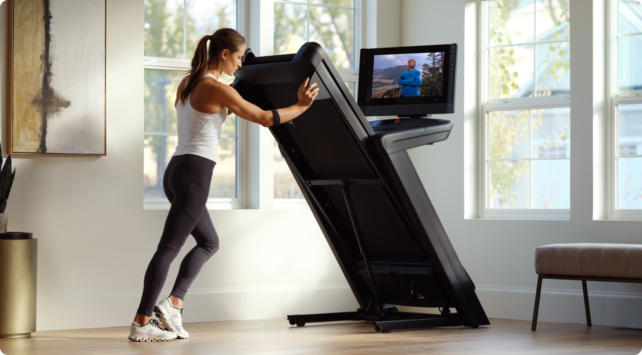woman folding her nordictrack treadmill