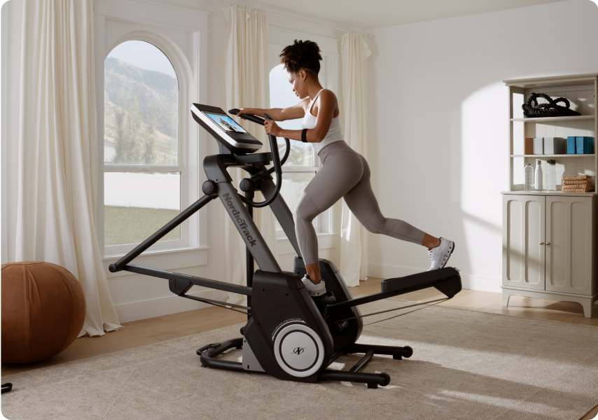 Woman workong out on a NordicTrack elliptical.